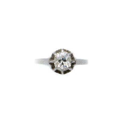 Solitaire ring centered with a cushion-cut...