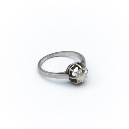 Solitaire ring centered with a cushion-cut...