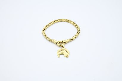 *Bracelet in yellow gold 750 ‰, holding a...