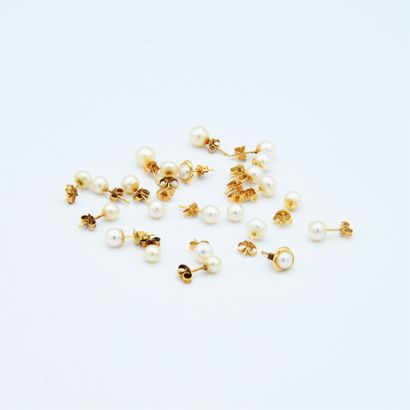 *A set of cultured pearl stud earrings in...