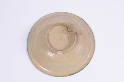Hollow dish in polychrome enamelled ceramic....