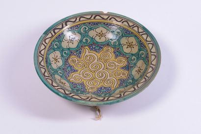Hollow dish in polychrome enamelled ceramic....