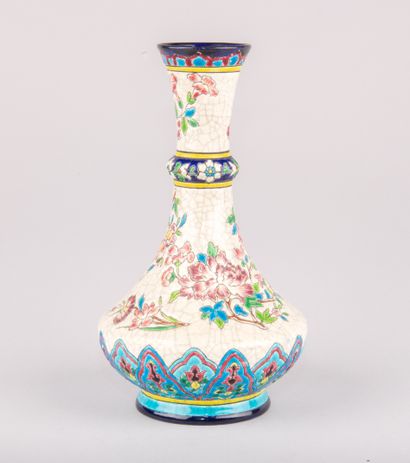 LONGWY,

Vase in polychrome enamelled earthenware...