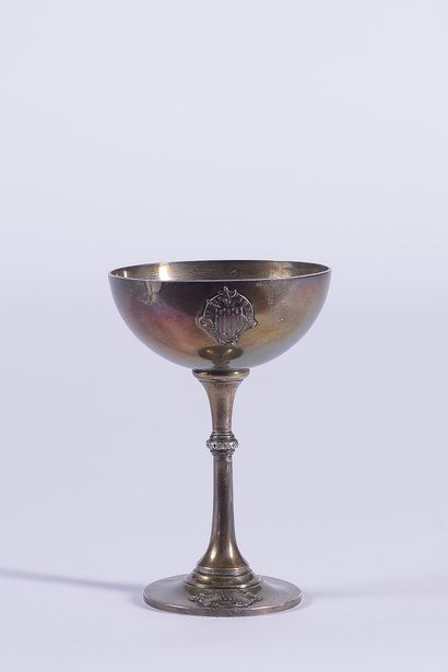 Small trophy cup in plain silver decorated...
