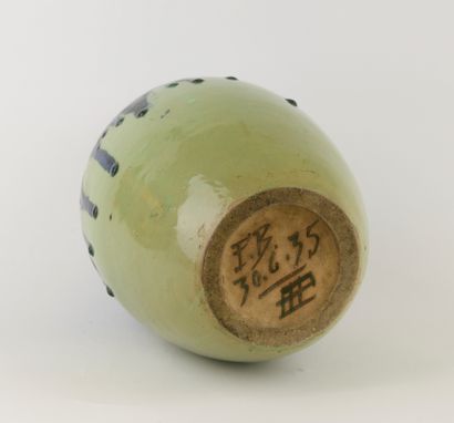 Large flared-neck obus vase in green-glazed...