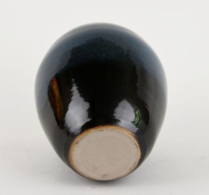 Stoneware ovoid vase with blue glaze. 
Signed...