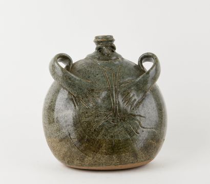 Stoneware anthropomorphic bottle with green...