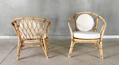 Pair of rattan armchairs with round cushions...
