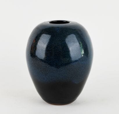 Stoneware ovoid vase with blue glaze. 
Signed...