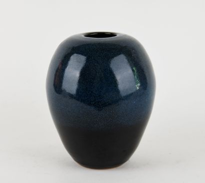 Stoneware ovoid vase with blue glaze. 
Signed...