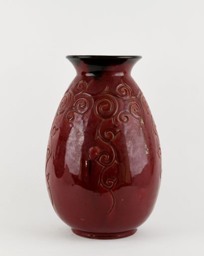 ACCOLAY
Ceramic vase with red glaze and incised...