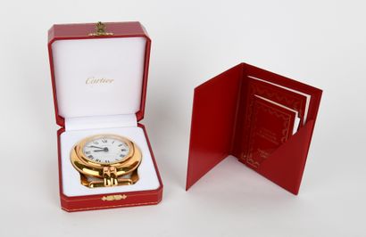 CARTIER.
Colisée clock in gilt metal with...