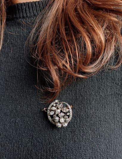 Pink gold and silver circular brooch featuring...