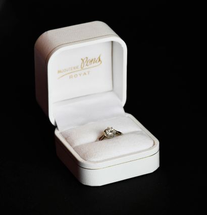 Solitaire set with a half-cut diamond, approx....