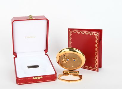 CARTIER.
Colisée clock in gilt metal with...