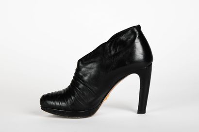 PRADA. Black leather ankle boots, instep...
