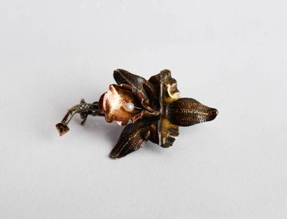 Brooch representing an orchid in patinated...
