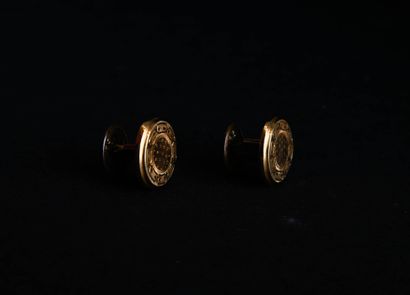 Pair of yellow gold cufflinks with metal...