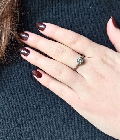 Solitaire set with a half-cut diamond, approx....