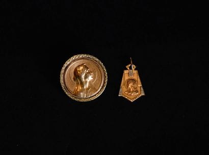 Two 18K (750 thousandths) yellow gold religious...