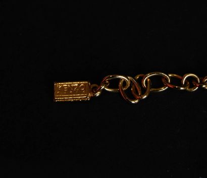 KENZO.
Set in gilt metal and red enamel with...