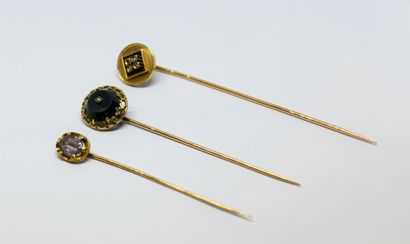 Set of three hatpins, one set with blood...