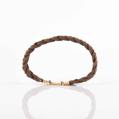 Bracelet braided with chestnut hair and finished...