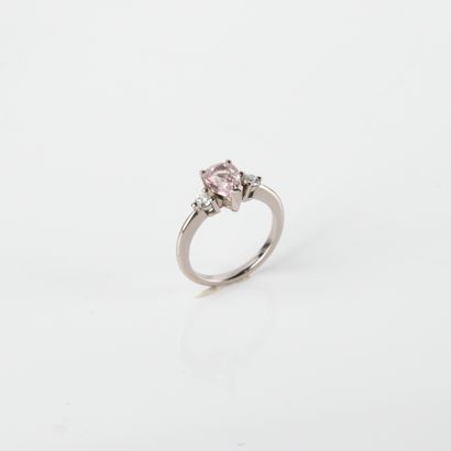 Ring adorned with a pear-shaped sapphire,...