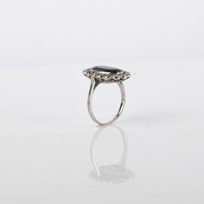 Ring centered on an oval-shaped blue-green...
