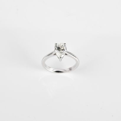 Solitaire ring set with a modern-cut pear-shaped...