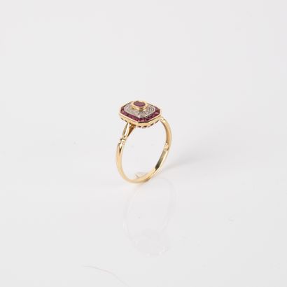 Modern ring centered on an oval ruby in a...