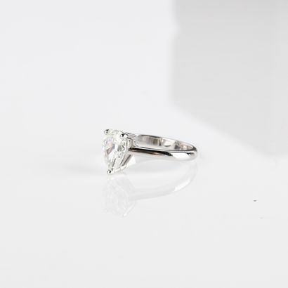 Solitaire ring set with a modern-cut pear-shaped...