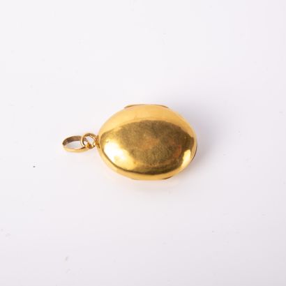 Reliquary pendant in oval yellow gold holding...