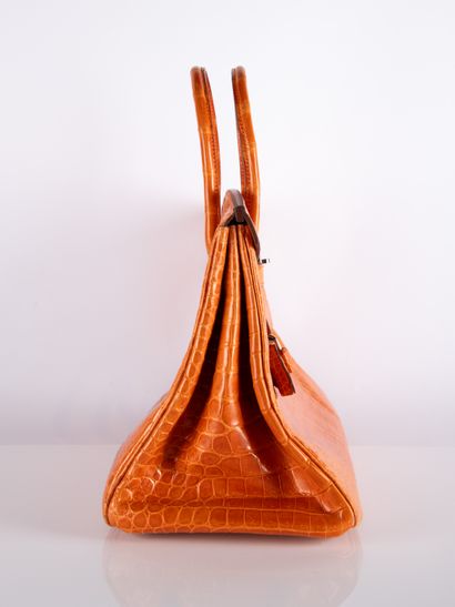 HERMES
Birkin 35 bag in orange crocodile...