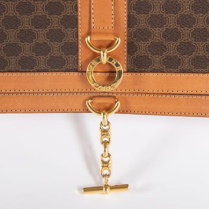CELINE
Monogram canvas and brown leather...