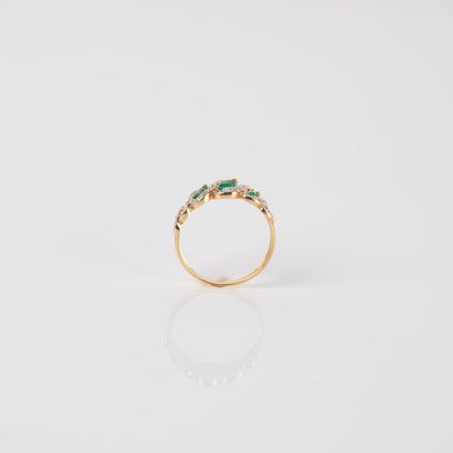 River ring with diamonds and three emeralds,...