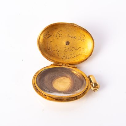 Reliquary pendant in oval yellow gold holding...