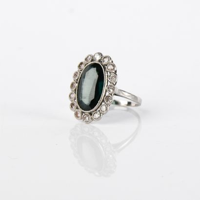 Ring centered on an oval-shaped blue-green...