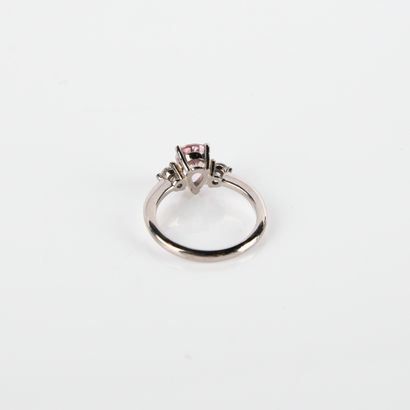 Ring adorned with a pear-shaped sapphire,...