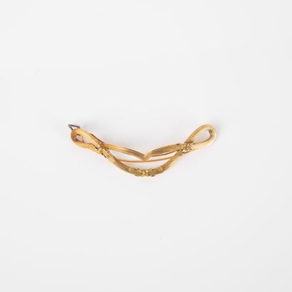 Broche en or jaune 18k 750°/00 à décor de...