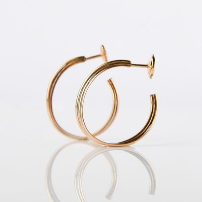 Pair of 18K (750 M) gold three-tone hoop...