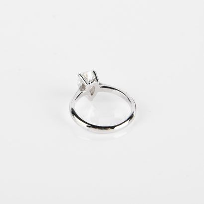 Solitaire ring set with a modern-cut pear-shaped...