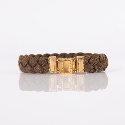 Bracelet braided with chestnut hair and finished...