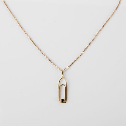 Pendentif trombone en or jaune centré d'un...
