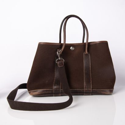 HERMES
Garden party bag in brown fabric and...