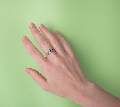 River ring with diamonds and three emeralds,...