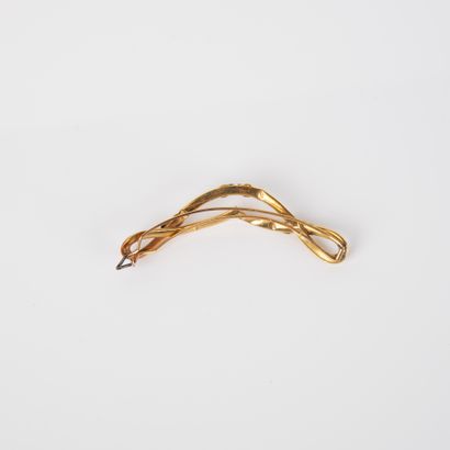 Broche en or jaune 18k 750°/00 à décor de...