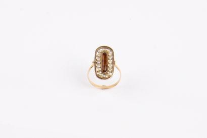 Pink gold (750°/00) ring with rocking bezel
The...