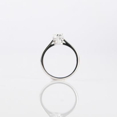 Solitaire ring set with a modern-cut pear-shaped...