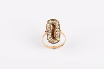 Pink gold (750°/00) ring with rocking bezel
The...